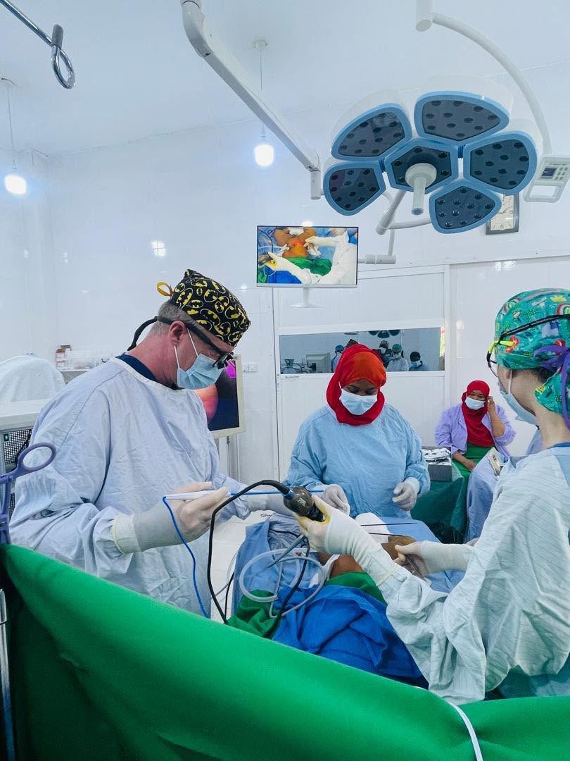 Surgeons performing a procedure together in the operating room